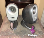 Silver Tannoy Arena satellites on matching cast bases, one facing forward and one angled on its ball joint