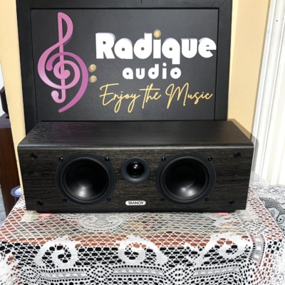 Tannoy Mercury FC Custom center speaker in dark woodgrain, grille off, with twin woofers flanking a central tweeter and Tannoy badge