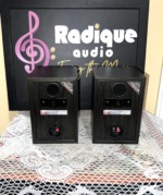 Rear of the Tannoy Mercury FR Custom speakers with keyhole wall mounts, rear port, model label and spring-clip terminals