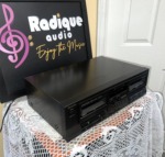 Technics RS-TR210 double cassette deck seen from the right, long black case with the two cassette doors and centre controls