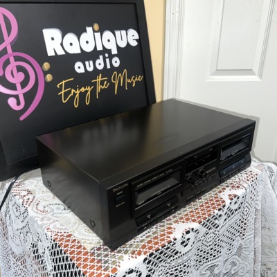 Technics RS-TR210 double cassette deck seen from the right, long black case with the two cassette doors and centre controls