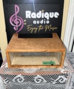 Radique Audio WC-10 style cabinet in Ottawa Valley cherrywood veneer, seen from the front through its open face