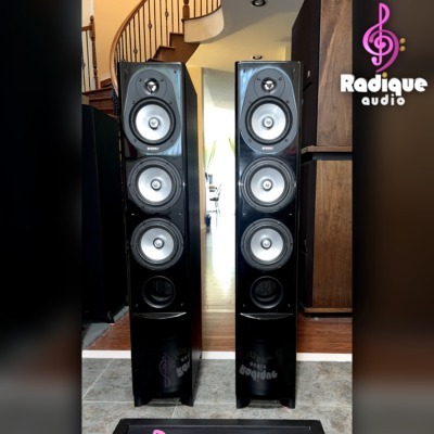 Energy Connoisseur CF-50 tower speakers — front view with grilles off, tweeter and three drivers visible