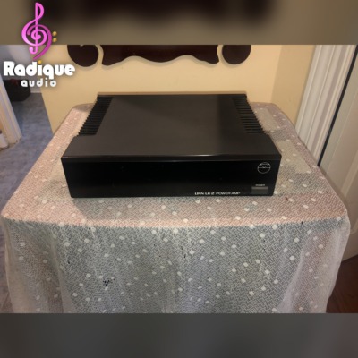 Linn LK2 power amplifier — front view of the black chassis with finned sides