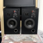 Pair of Vision Acoustics V 500 bookshelf speakers, grilles off, each with a dome tweeter, woofer, front bass port and Model V 500 badge