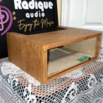Radique Audio WC-10 style cherrywood cabinet from the left at an angle, showing the cherry grain on the top and side panels