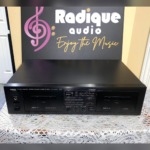 Yamaha KX-W232 double cassette deck in black, front panel with Deck A record/playback and Deck B playback doors, tape counter and peak level meters